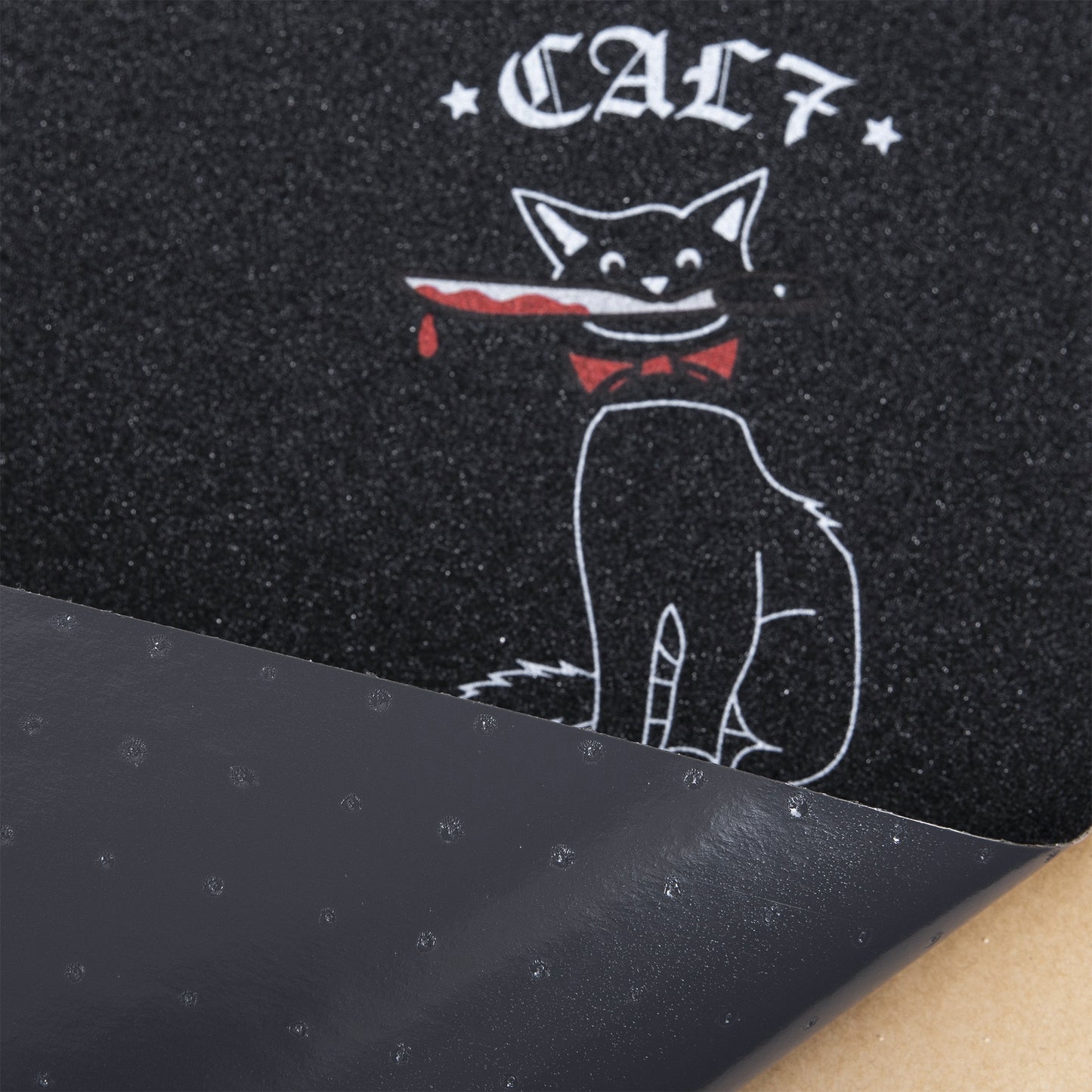 Cal 7 black skateboard griptape with knife-wielding cat design