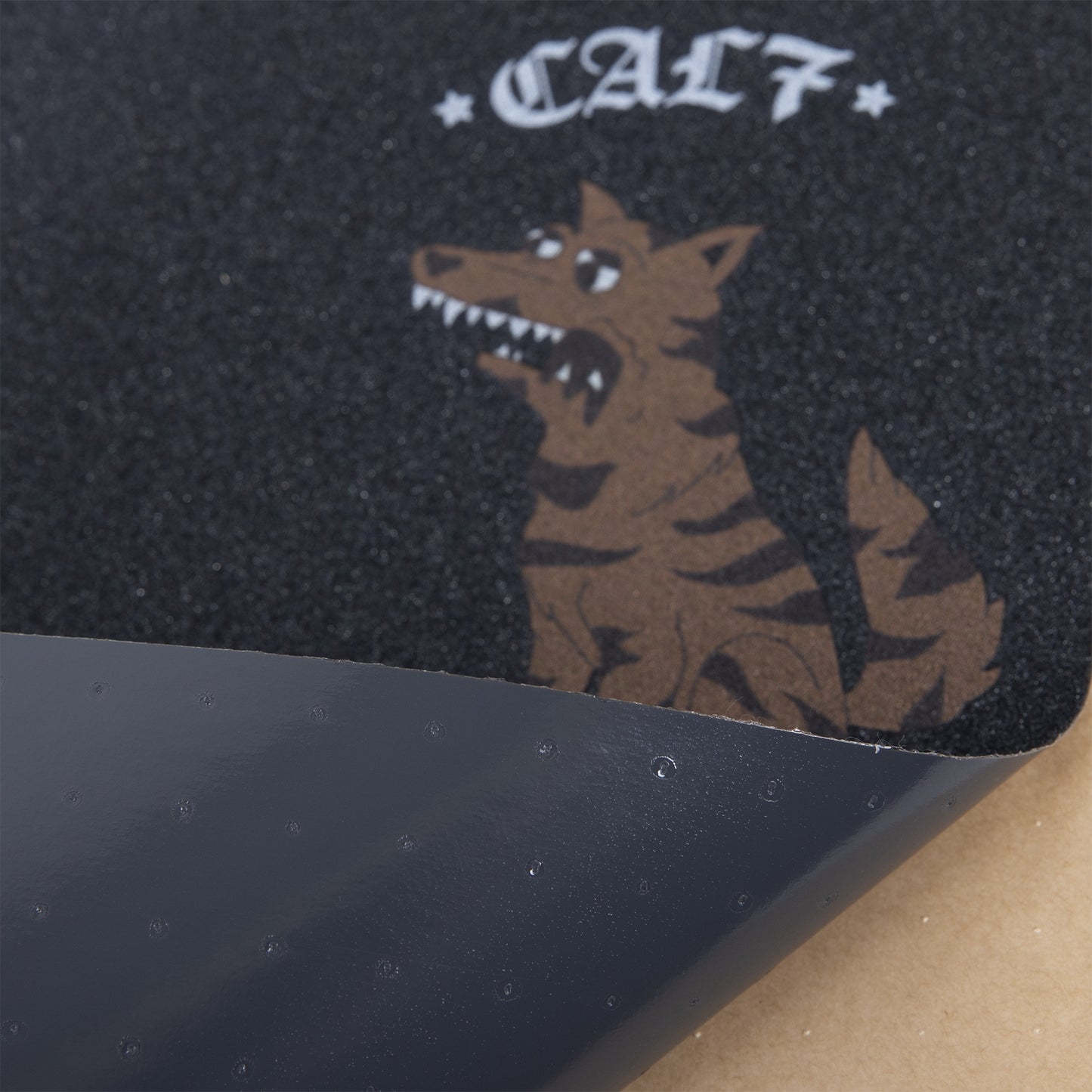 Cal 7 black skateboard griptape with dog design