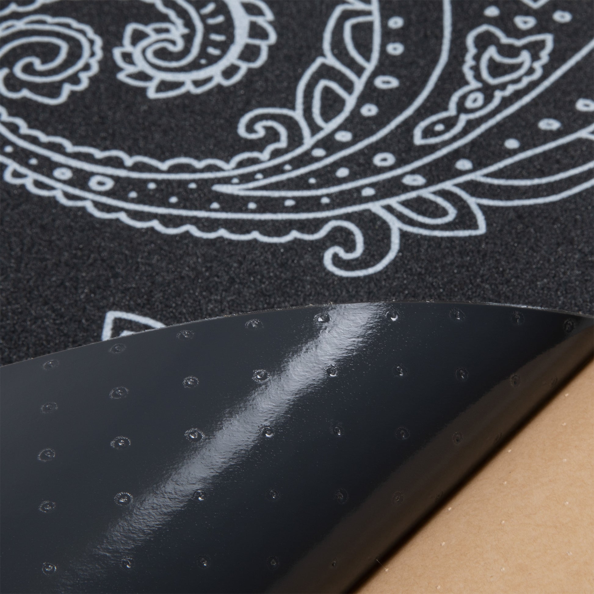 Cal 7 black skateboard griptape with paisley design